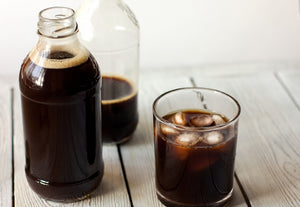 Cup of cold brew coffee with jug