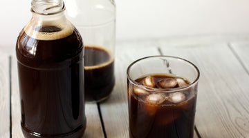 Cup of cold brew coffee with jug