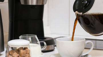 Pouring drip brew coffee into a mug